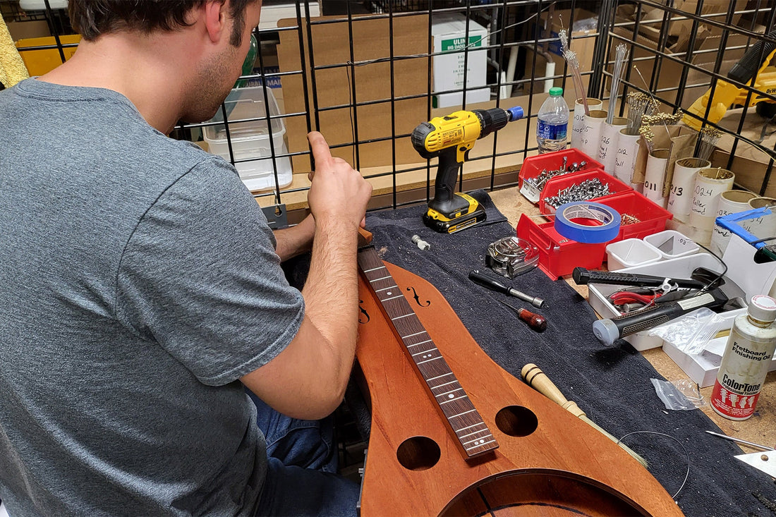 dominic working on a resonator dulcimer