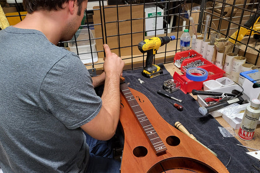 dominic working on a resonator dulcimer