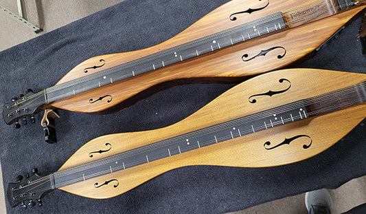 Richard's Galzax-style dulcimer alongside a new one they just made this week