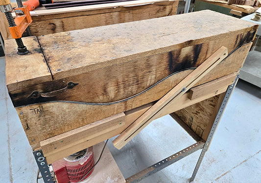 tall stack of Folkcraft fretboard blanks drying on a cart