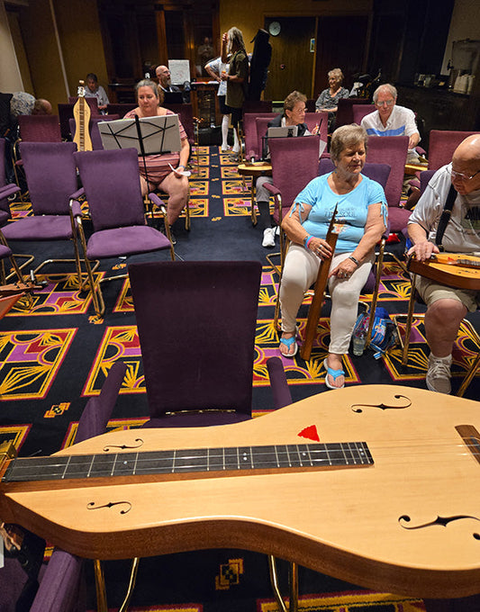 richard ash's dulcivox setting on a makeshift stand - made from two chairs - at the front on his class