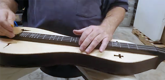 Richard Ash demonstrating newly built rosewood spruce Folkcraft mountain dulcimer