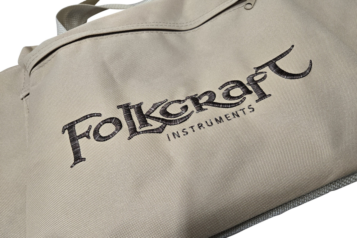Dulcimer carrying case, tan, embroidered Folkcraft Instruments logo, logo detail